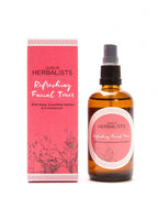 Refreshing Facial Toner amber spray bottle standing next to pink botanical packaging box
