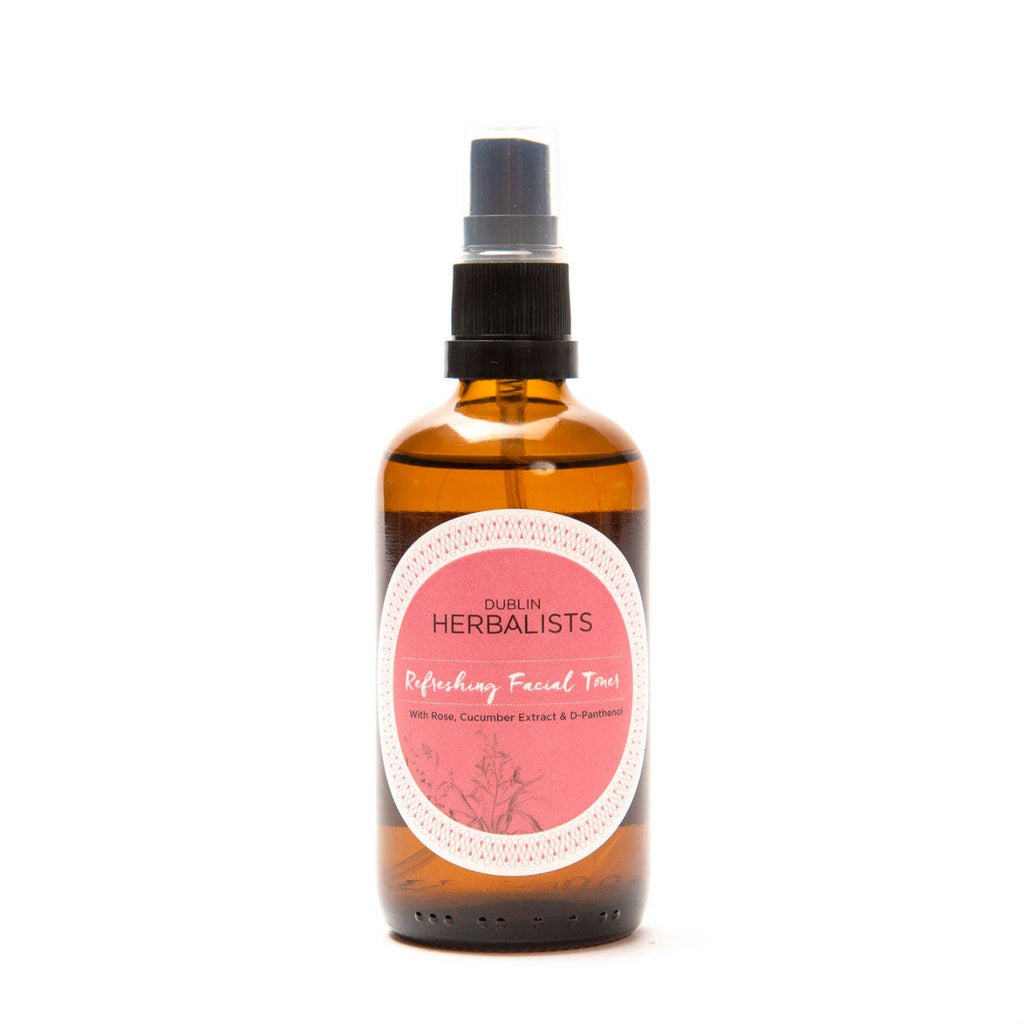 Amber glass spray bottle of Refreshing Facial Toner with pink label