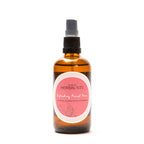Amber glass spray bottle of Refreshing Facial Toner with pink label