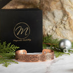 Magnetic Mobility Claddagh Ireland Copper Magnetic Bracelet – front view – embossed copper cuff with Claddagh and Triquetra motifs.