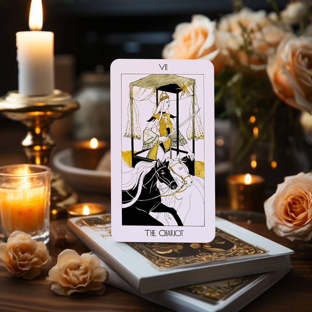 The Golden Path Tarot card The Chariot standing on deck box with candle background
