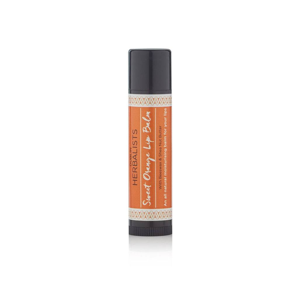 Single tube of Sweet Orange Lip Balm with orange label against a white background