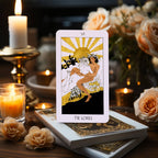 The Golden Path Tarot card The Lovers displayed with candles and roses