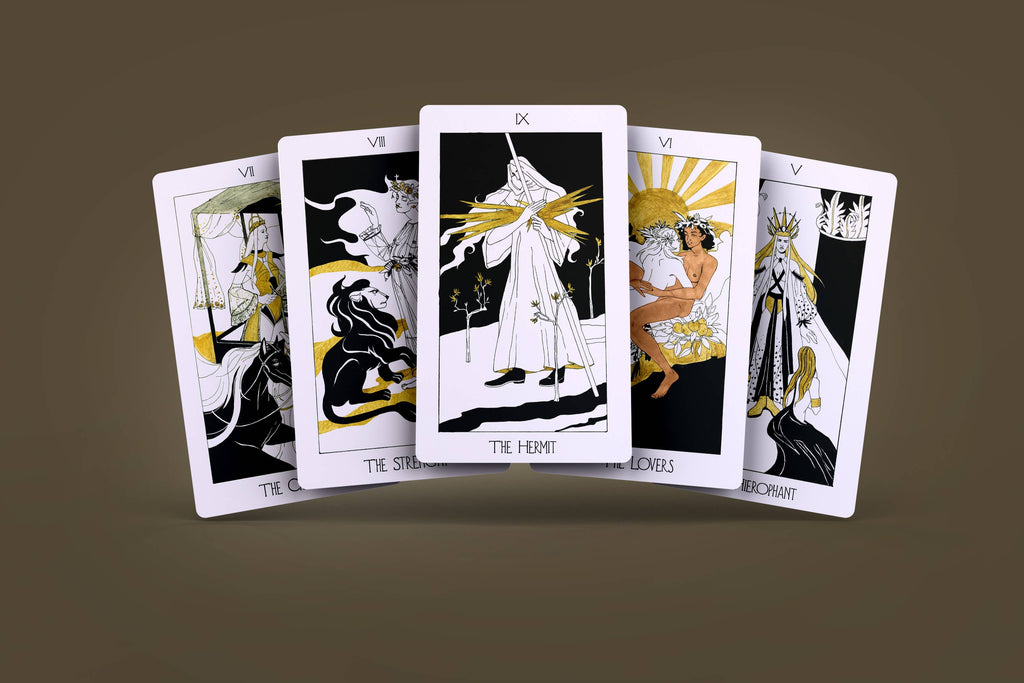 Fan of five Golden Path Tarot cards showing black and gold Art Deco illustrations