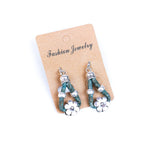Meninas Bonitas Cork Flower Accessories Handmade Earrings 4x1.5cm – detail – teal cork drop earrings with silver-tone flower pendant and decorative beads.