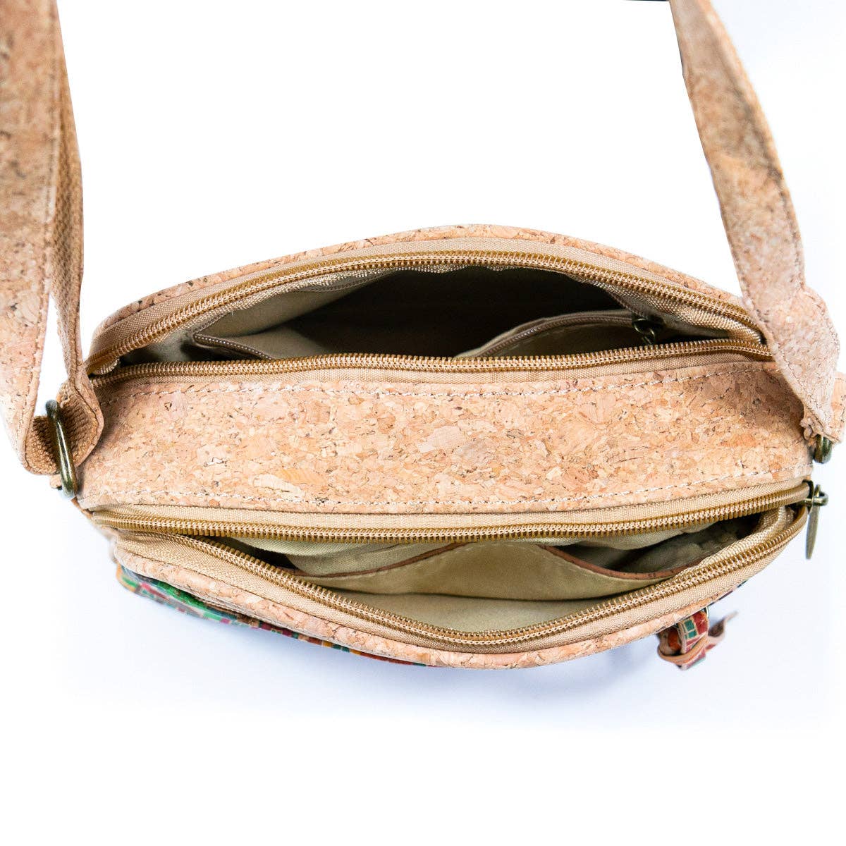 Meninas Bonitas Cork Patchwork Crossbody Bag 21x15x8cm – interior – open top view showing three separate zippered compartments lined in beige fabric.