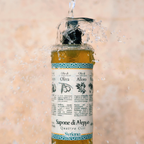 Syriana Quattro Olii Liquid Aleppo Soap 400ml - bottle being rinsed with splashing water